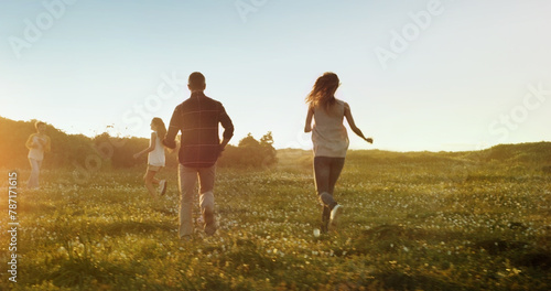 Freedom, travel and family running on field with energy, love and fun bonding in nature together. Games, back and kids with parents in countryside for adventure, journey or vacation at sunset in park