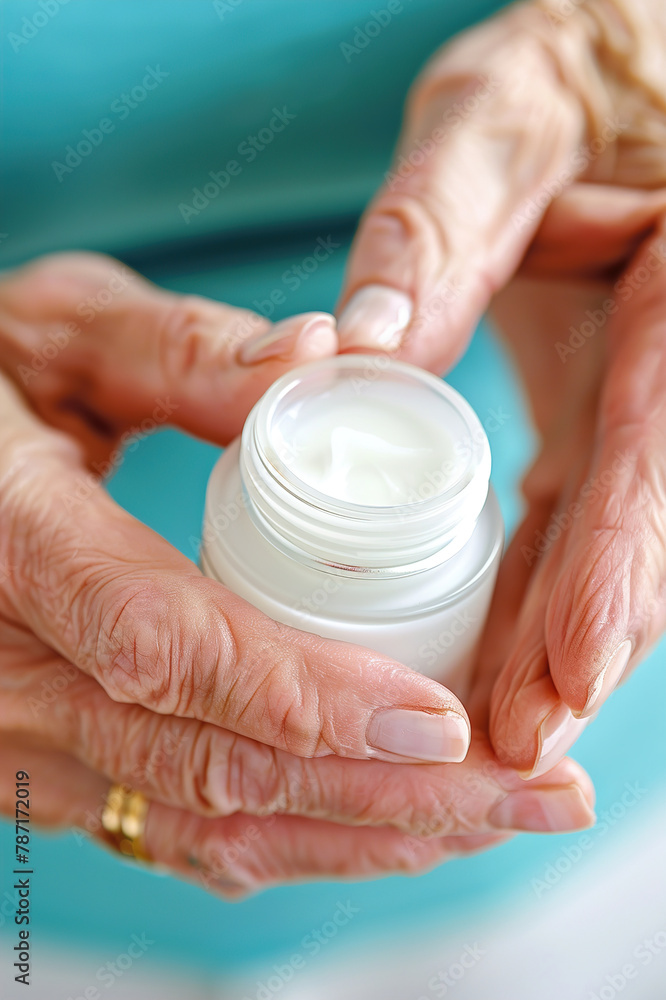An individual applying soothing cream to alleviate discomfort caused by a red, inflamed skin rash. An individual applying soothing cream to alleviate discomfort caused by a red, inflamed skin rash.