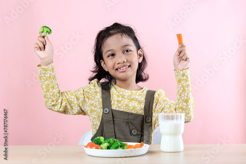 Asian Kids Enjoying Carrot and Broccoli Vegetable for Breakfast