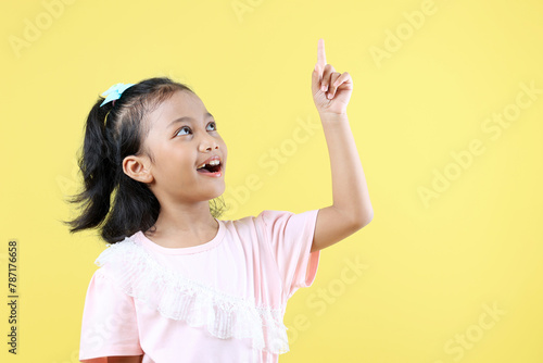 Asian Girl AHA Great Idea Concept on Yellow Background