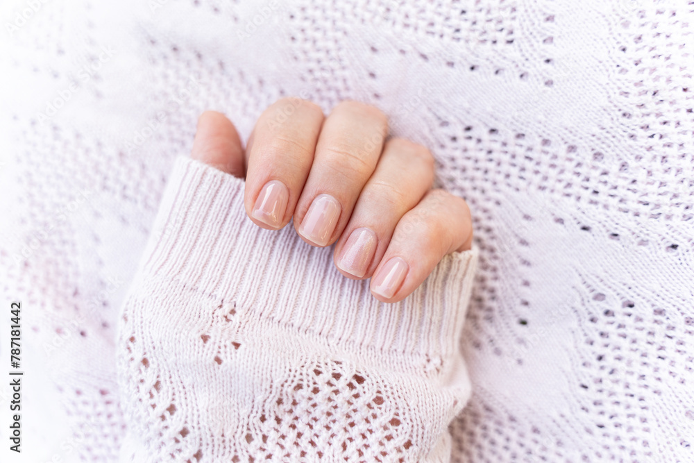 Maintained female nails. Beautiful and natural manicure. Gel polish. Cleaned, shaped and varnished nails. Nail care.