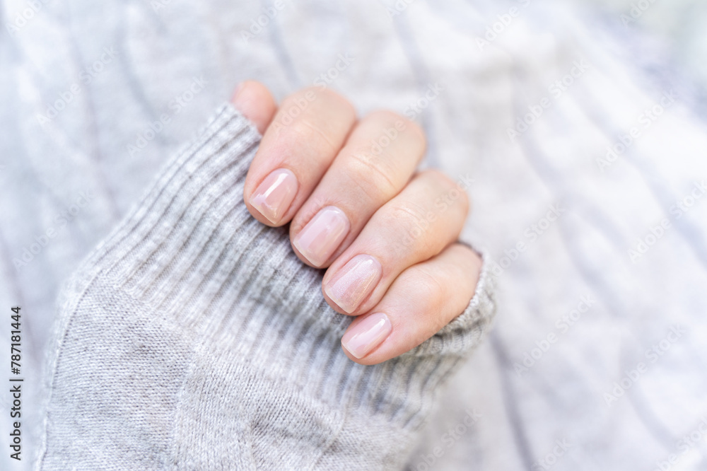 Maintained female nails. Beautiful and natural manicure. Gel polish. Cleaned, shaped and varnished nails. Nail care.