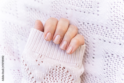 Obraz na płótnie Maintained female nails. Beautiful and natural manicure. Gel polish. Cleaned, shaped and varnished nails. Nail care. w salonie