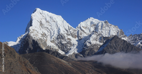 Snow covered mountains Cholatse and Tobuch, view from the Gokyo Valley, Nepal. photo