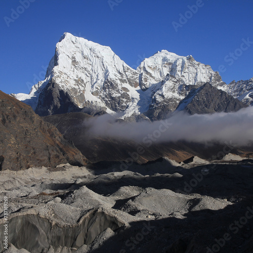 Ngozumba Glacier and high mountains Cholatse and Tobuche, Nepal. photo