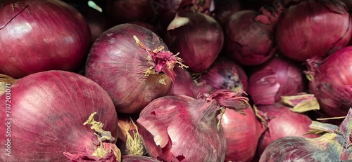 red onions in a market