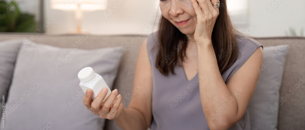 Senior lady suffering from pain or headache doubt about taking painkiller pill, upset aged woman have antibiotics or prescribed medicines Senior lady suffering from pain or headache doubt about taking painkiller pill, upset aged woman have antibiotics or prescribed medicines