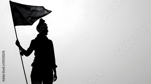 Black silhouette of a woman holding a  black flag, image captures a moment of assertive stance and expression, isolated on gray background