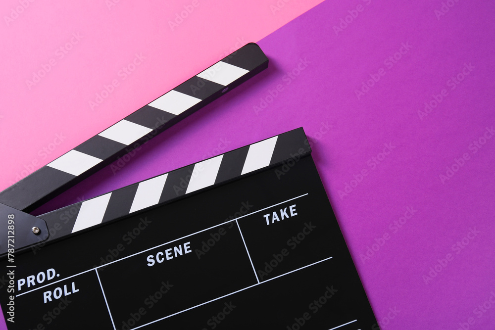 Clapperboard on color background, top view. Film industry