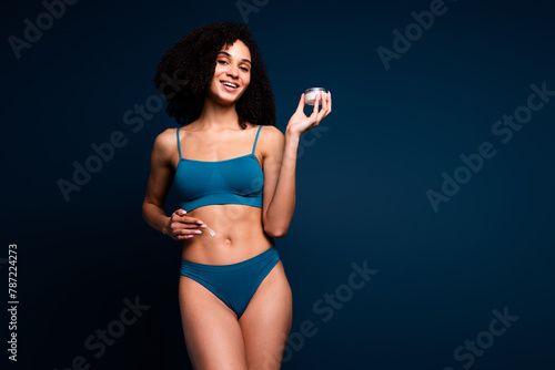 No retouch photo of sweet adorable lady underwear lingerie apply lotion loving herself empty space isolated blue color background