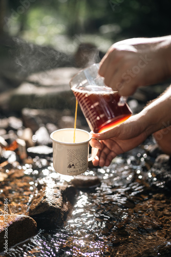 A man is pouring coffee int...