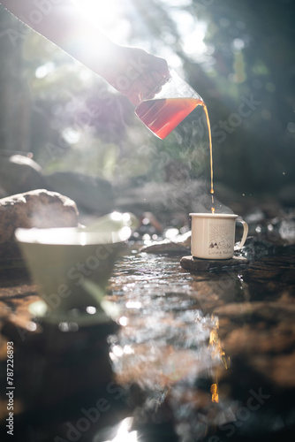 A man is pouring coffee int...