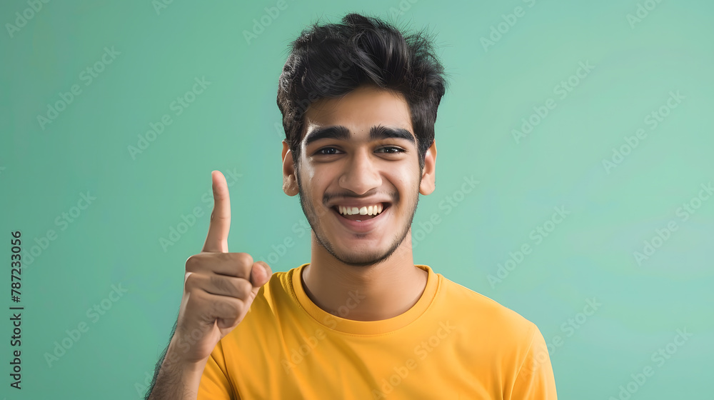 Young cool happy Indian man 20s in basic yellow tshirt point index finger camera on you say do it motivating isolated on plain pastel light green background studio portrait People life : Generative AI Young cool happy Indian man 20s in basic yellow tshirt point index finger camera on you say do it motivating isolated on plain pastel light green background studio portrait People life : Generative AI