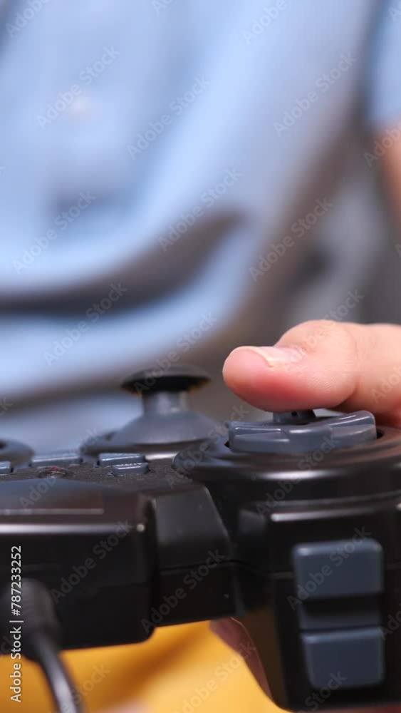 vertical video Using controller playing video games - close up of joypad vertical video Using controller playing video games - close up of joypad