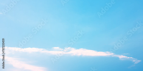 It's a hot day with the sun shining down on a blue sky filled with alternating small and huge clouds moving gently while the light from the sky creates a remarkable abstract shape. Horizon, Cloud Back