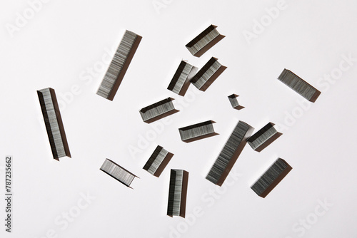 Overhead view of staples on white background photo