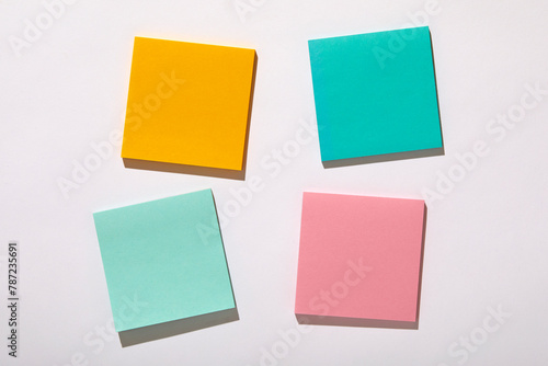 Colorful blank adhesive notes on white background