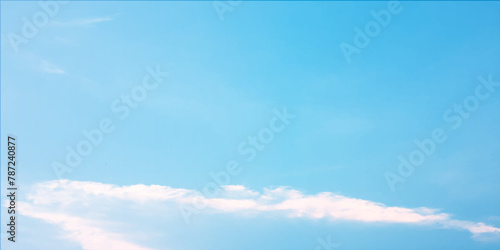 It's a hot day with the sun shining down on a blue sky filled with alternating small and huge clouds moving gently while the light from the sky creates a remarkable abstract shape. Horizon, Cloud Back