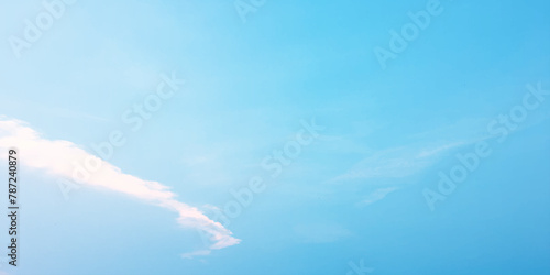 It's a hot day with the sun shining down on a blue sky filled with alternating small and huge clouds moving gently while the light from the sky creates a remarkable abstract shape. Horizon, Cloud Back