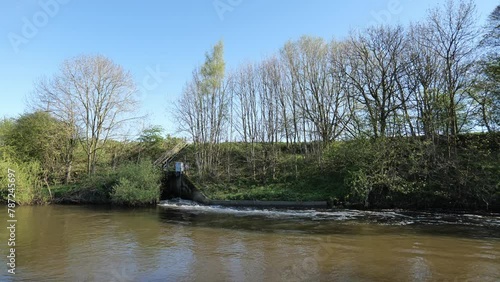 Wastewater discharging from the Esholt Sewage Treatment Works. Treated water can be seen flowing into the River Aire outside of Leeds, UK.
