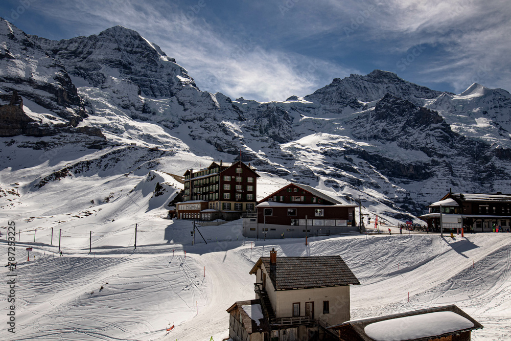 Ski resort in snowy mountains / Swiss Alps blue sky and sunshine. Wengen, Switzerland
