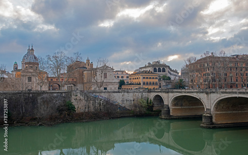 Old stone bridge over a large river in European city