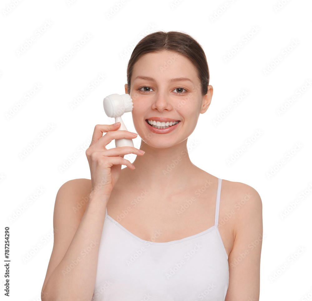 Washing face. Young woman with cleansing brush on white background Washing face. Young woman with cleansing brush on white background
