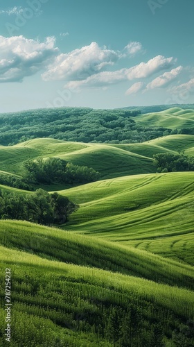 Picturesque green rolling hills landscape with blue sky and clouds