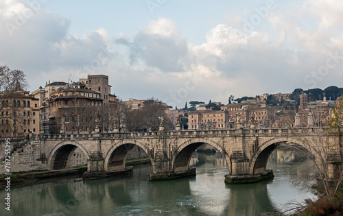 Old stone bridge over a large river in European city