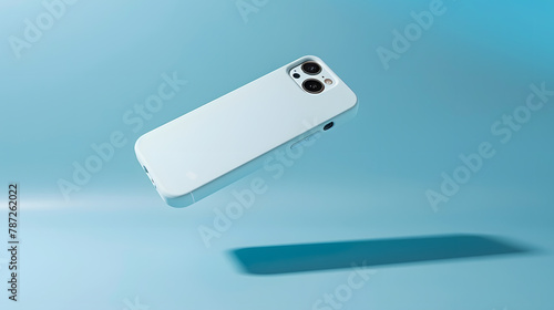 iPhone 14 and 13 Pro Max in light blue soft silicone case falls down back view phone cover mockup in monochrome colours isolated on blue background : Generative AI photo