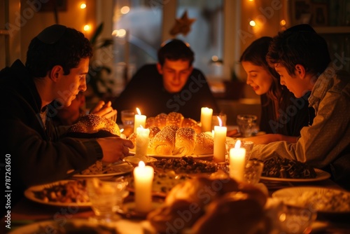 An Orthodox Jewish family enjoys Shabbat dinner. The golden light of burning candles creates a cozy atmosphere.