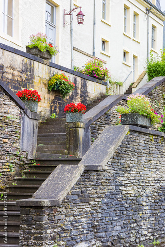 Flowers on the stairs leading to a house in Bouillon, Belgium