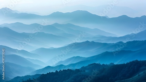 Captivating Misty Mountain Landscape with Layered Blue Ridges and Serene Valley Backdrop