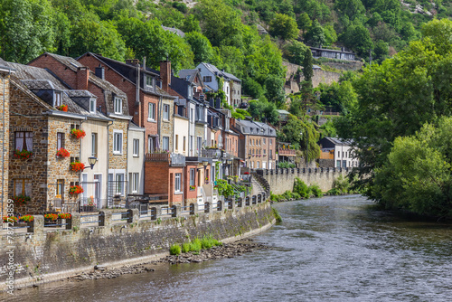 River Ourthe bending along old houses in La Roche-en-Ardenne, Belgium photo