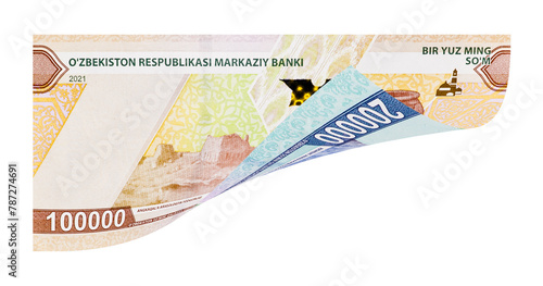 Uzbek one and two hundred-thousand banknotes as a concept of increasing the value of national currency. Image isolated on white background