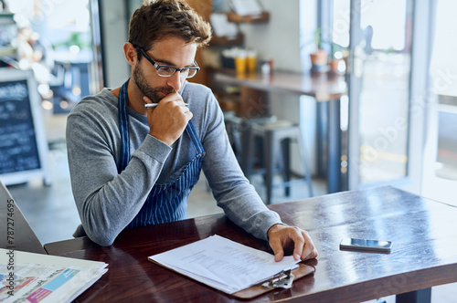 Coffee shop, waiter and man with clipboard in restaurant for stock checklist, inventory or review of price. Cafe, small business and employee with documents for supply chain, feedback and planning photo