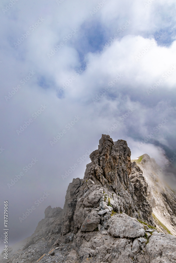 Clouds Over the Rugged Cliffs and Steep Slopes of Gamsluggen by Lünersee