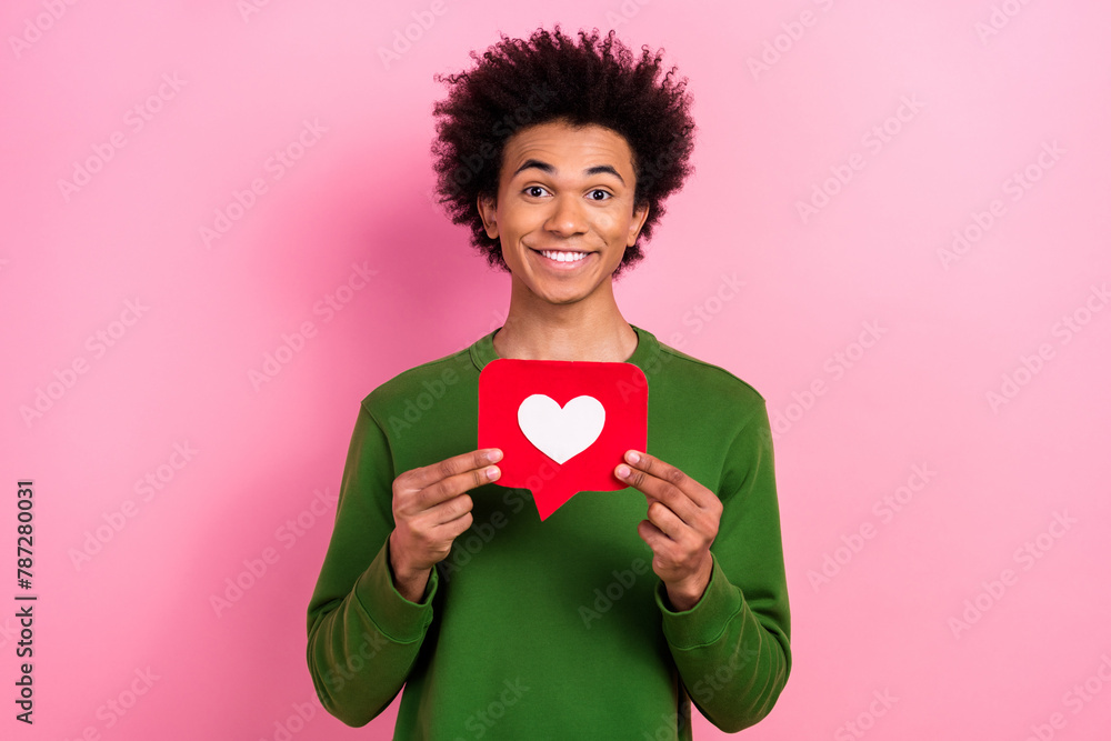 Photo of happy positive guy hold like heart social media reaction isolated pastel color background Photo of happy positive guy hold like heart social media reaction isolated pastel color background