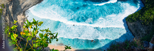 Banner Turquoise ocean sea water white wave pattern splashing deep blue sea. Banner Tropical sea beach Seascape dark background wave splash on rock. Summer Ocean Surface big wave with copy space