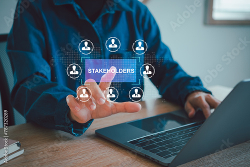Stakeholders concept. Person touching stakeholders icon on virtual screen for business finance stakeholder investment management. Different stakeholders contact collaboration for company organization photo