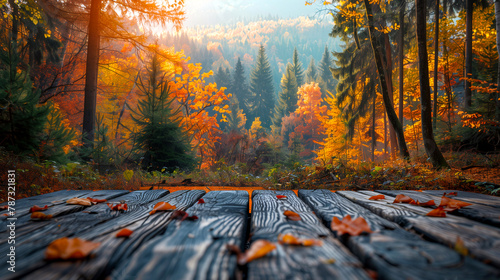 Wooden table with autumn leaves in the park. Autumn background.