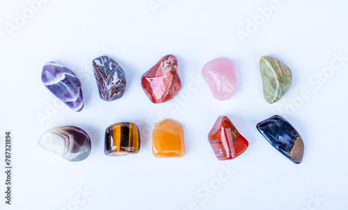 Semi-precious multi-colored stones, minerals on a white background close-up. Mineralogy. Collection of minerals.