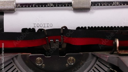 sequence of ones and zeros in binary code written with old typewriter with black ink photo