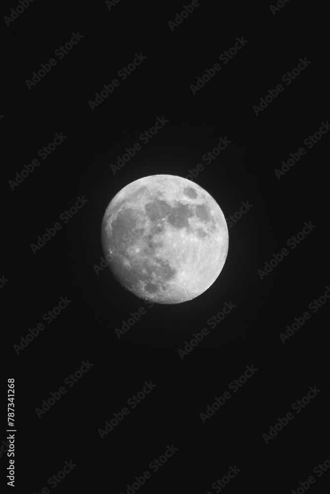 Almost full moon with black background