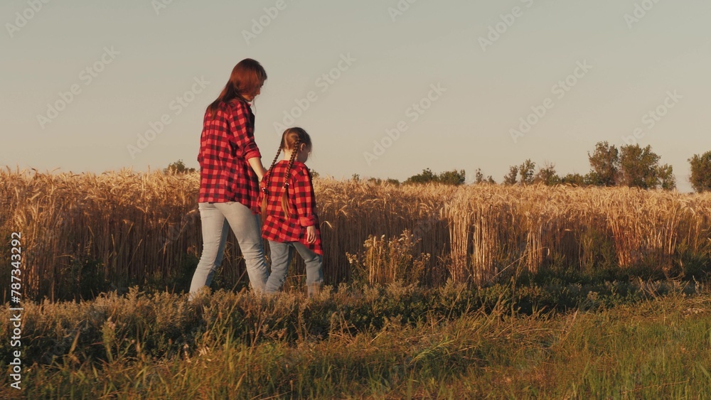 child girl daughter kid holding hand farmer mother, agriculture, business wheat field, friendly family, mother farmer holding her daughter hand wheat field, hands parent child, farmer with child - obrazy, fototapety, plakaty 