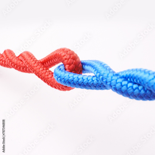 Ropes, connected and tied together in studio for fastening, towing and securing heavy equipment in construction. Cordage, colourful and strong for pulling, strength and hauling furniture safely