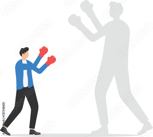 Fight your fears, win yourself, Businessman holding fists with Boxing gloves ready to fight himself as a shadow projection, Facing fears against his shadow

