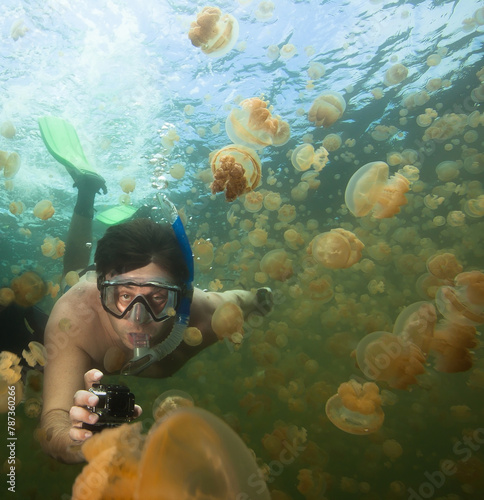 Man snorkeling in Jellyfish lake, Palau.