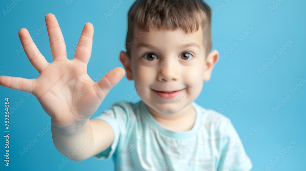 child boy showing five fingers on blue background copy space portrait of a 5 year old boy : Generative AI child boy showing five fingers on blue background copy space portrait of a 5 year old boy : Generative AI