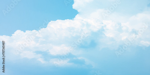 It's a hot day with the sun shining down on a blue sky filled with alternating small and huge clouds moving gently while the light from the sky creates a remarkable abstract shape. Horizon, Cloud Back